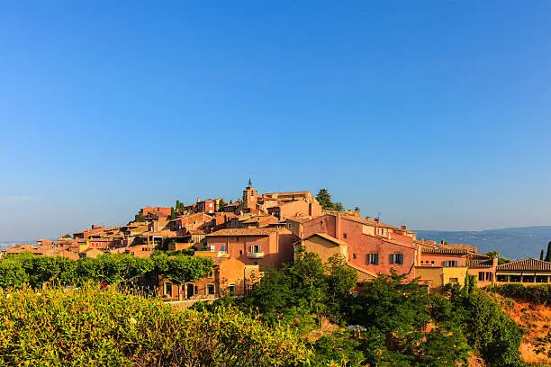 Roussillon is a true marvel of colors, well known as one of the most beautiful villages in France. The narrow streets of the old town are lined with houses painted in many shades of ocher and red, that shine at sunset. Provence-Alpes-Côte d'Azur region, southeastern France.