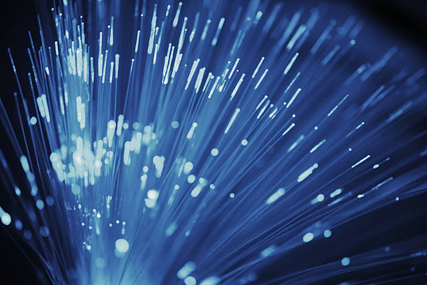 istock Fiberoptic data transmission appearing as purple lights and dots 481074424