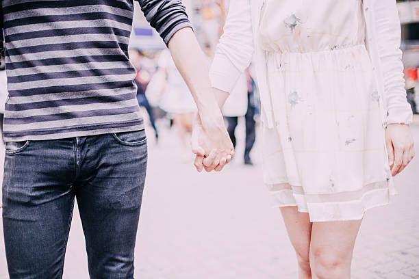 istock Young couple against cityscape background 481074440