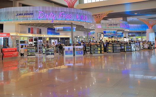 Bangkok Thailand - April 23, 2015: People shop at duty free shops at Don Mueang International airport in Bangkok Thailand.