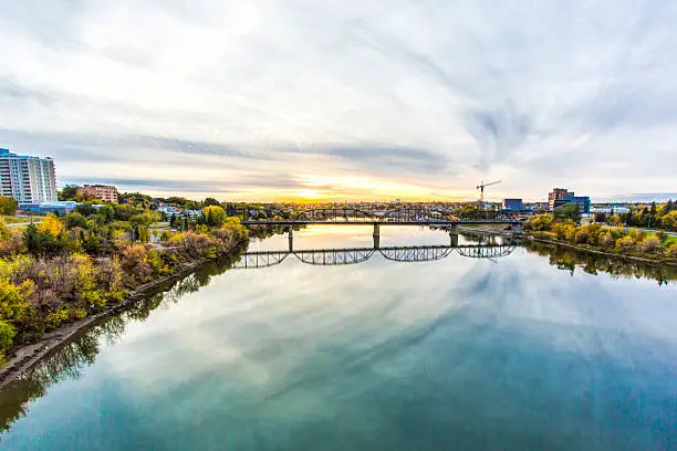 The South Saskatchewan River that runs through the city of Saskatoon, Canada under the Victoria Bridge
