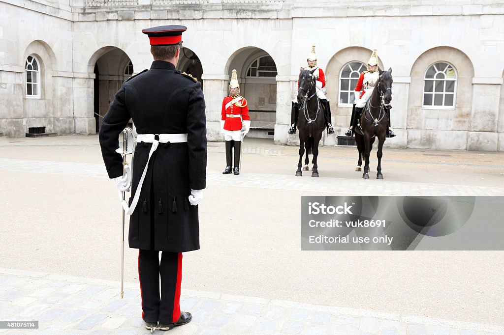 Queen's Life Guard London, England - June 27, 2015: Queen's Life Guard after The Guard Changing Ceremony in front of The Buckingham Palace, on The Mall. Courtyard Stock Photo