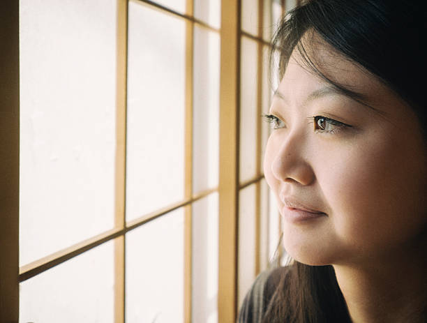 istock Japanese Woman Looking Out Window 481078144