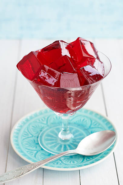 istock Red jelly cubes in glass 481078496