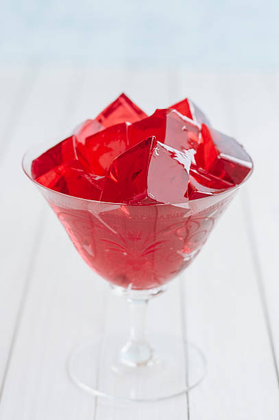 istock Red jelly cubes in glass 481078592