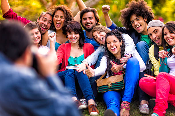 istock Taking photograph to group of young students sharing at campus 481079155