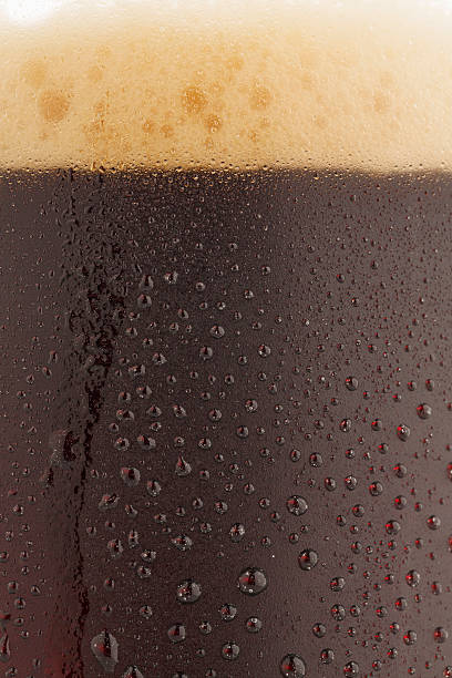 istock Ice cold  glass of dark beer  covered with water drops 481079368