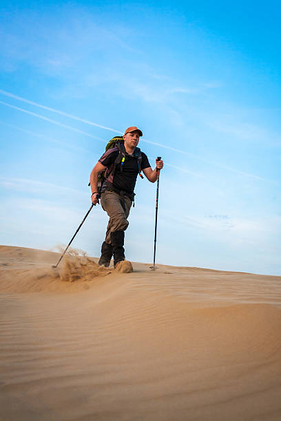 istock Man With Backpack Hiking In The Desert 481079570