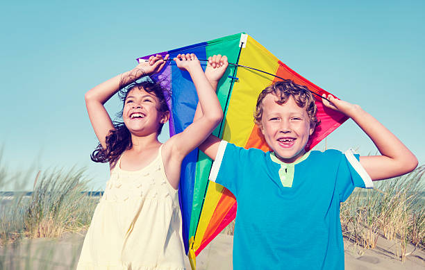 istock Children Playing with the Kite Outdoors 481080096