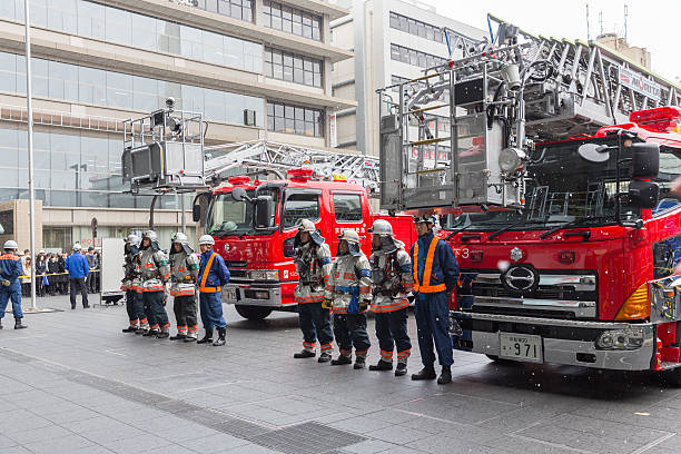 Kyoto, Japan - March 6, 2014: Fire engines and rescue teams assemble at the Kyoto Station in Japan for a fire drill. This drill is held to prevent fire or other emergency.