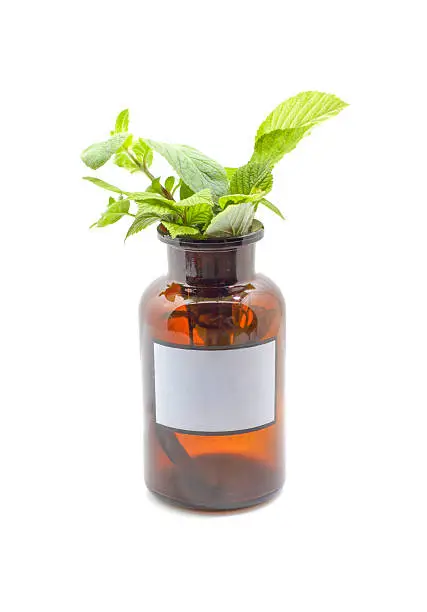 alternative treatment with herbs and oils on isolated background