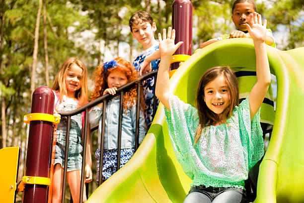 istock Elementary children play at school recess or park on playground. 481081693