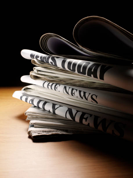 istock Pile of Newspapers on a Desk 481082943