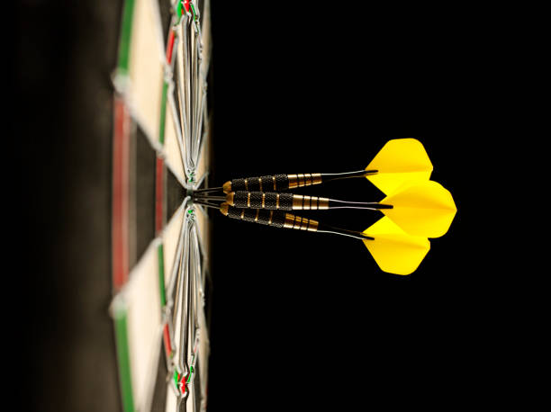 istock Three Darts Scoring a Bull's Eye in a Dartboard 481083131
