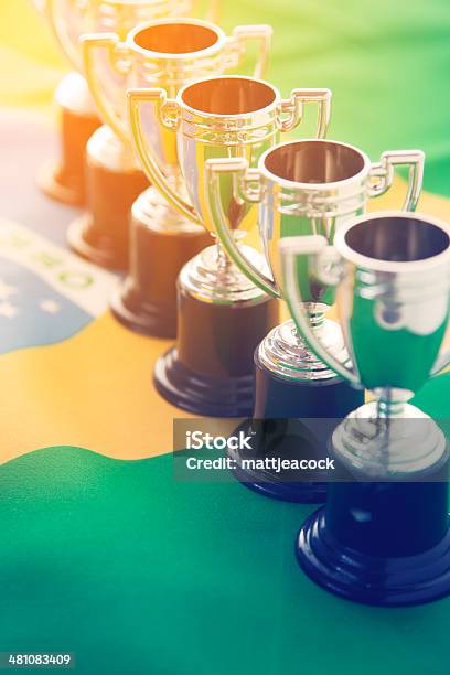 Brazilian Flag And Winning Trophies Stock Photo - Download Image Now - Achievement, Award, Awards Ceremony