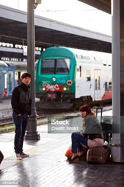 Passengers Waiting For A Train On Bologna Railway Station Stock Photo - Download Image Now