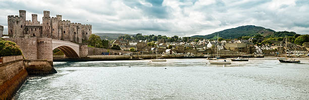 Town of Conwy panorama, Wales, UK Town of Conwy panorama in Wales, UK. This image features the marina, village, bridge and castle. conwy castle stock pictures, royalty-free photos & images