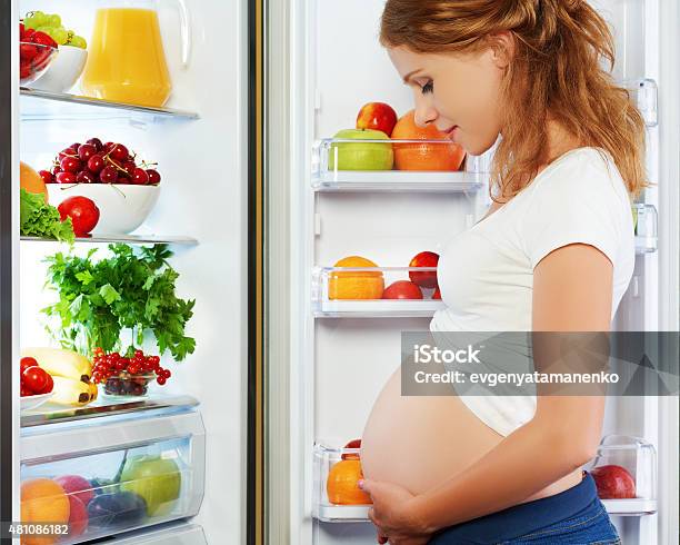 Nutrition And Diet During Pregnancy Pregnant Woman With Fruits Stock Photo - Download Image Now