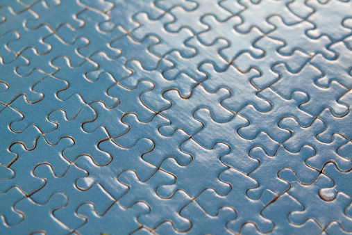 Blue back lit puzzle close up.