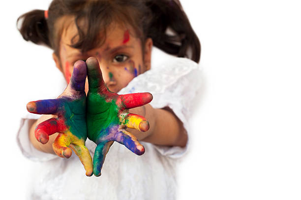 istock Small girl showing colorful hands 481086737