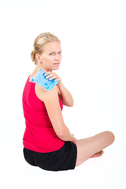 gel pack on shoulder Cool gel pack on a swollen hurting shoulder. physical injury sport ice pain stock pictures, royalty-free photos & images