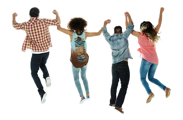 istock Rear view of four friends jumping together 481089978