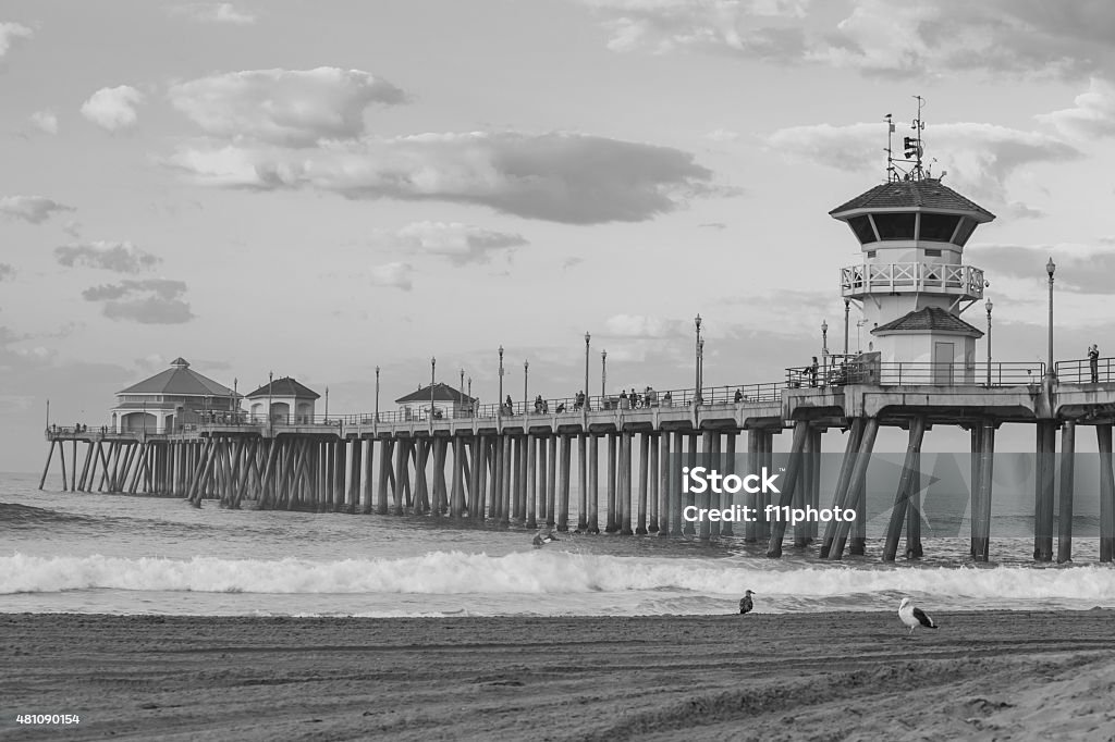 The Huntington Beach pier at sunrise The Huntington Beach pier at sunrise, CA black and white 2015 Stock Photo