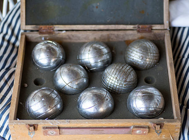 Old game using hollow metal balls