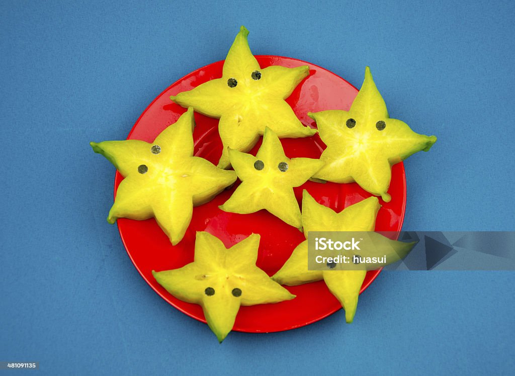 Anthropomorphic fruits:Sliced carambola, like a starfish. Anthropomorphic Stock Photo