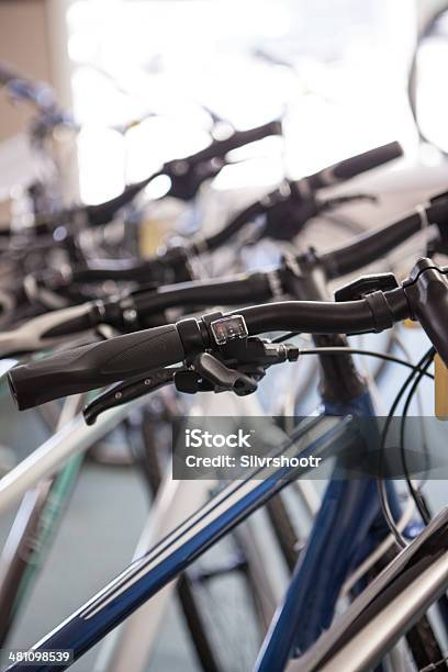 Bicycles For Sale Lined Up In A Bike Shop Stock Photo - Download Image Now - Aluminum, Back Lit, Bicycle