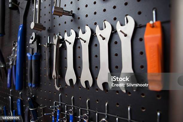 Wrenches Hanging In A Bicycle Shop Stock Photo - Download Image Now - Pegboard, Auto Repair Shop, Garage
