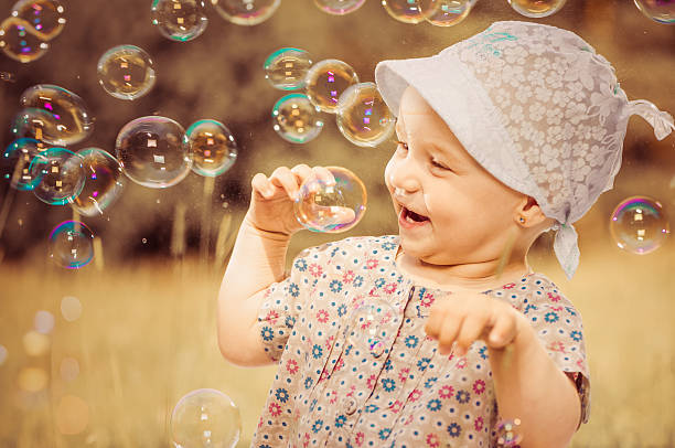 istock happy girl with bubbles 481099422