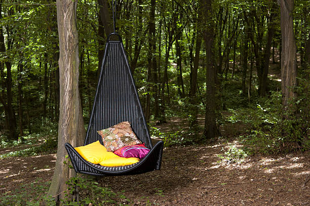 istock Hanging rattan chair on garden 481101897