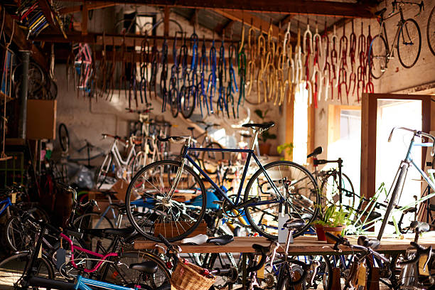 Welcome to the bicycle workshop Shot of a bicycles and equipment in a bicycle repair shophttp://195.154.178.81/DATA/i_collage/pu/shoots/805313.jpg bicycle shop stock pictures, royalty-free photos & images