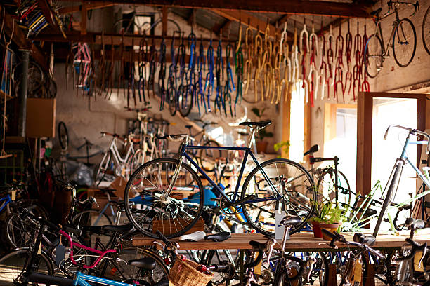 Welcome to the bicycle workshop Shot of a bicycles and equipment in a bicycle repair shophttp://195.154.178.81/DATA/i_collage/pu/shoots/805313.jpg bike workshop stock pictures, royalty-free photos & images
