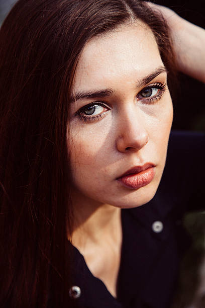 istock Young woman wearing blue dress 481104906