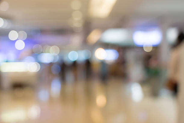 istock blurred image of shopping mall and people 481105782