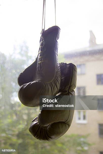 Old Boxing Gloves On The Background Of The Window Stock Photo - Download Image Now - 2015, Aging Process, Ancient