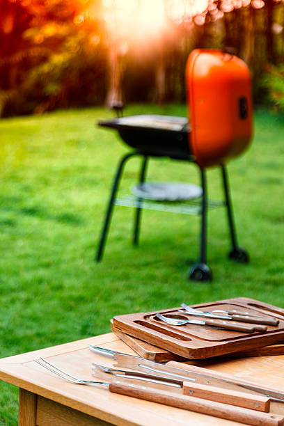istock Ready for Barbeque with table and utensils in house garden 481107777