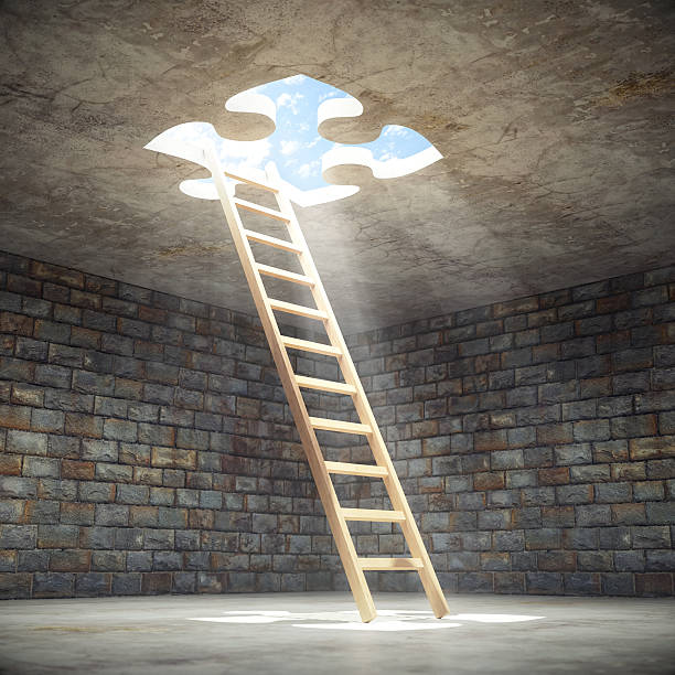 Ladder Leading Up To The Light Wooden ladder leading up to the light from inside of a puzzle shaped hole in a dark dungeon. light at the end of the tunnel stock pictures, royalty-free photos & images