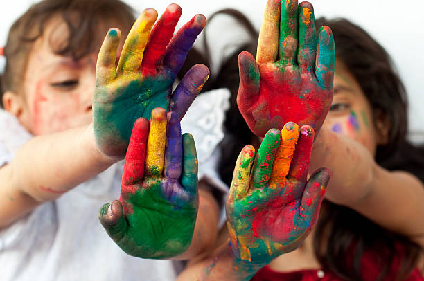 istock Two girls showing colorful hands 481112499