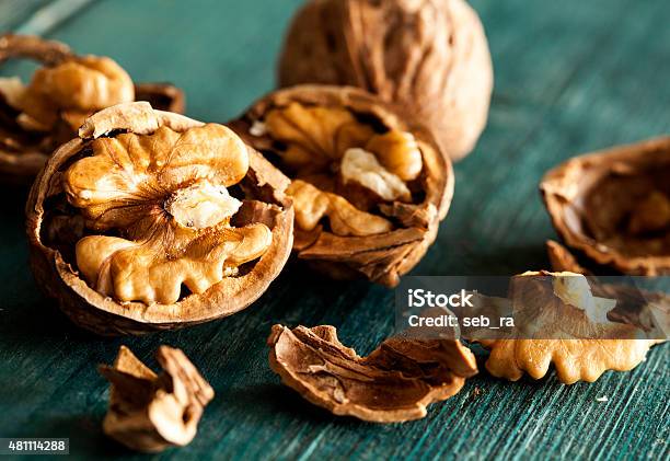 Walnuts On Wooden Table Stock Photo - Download Image Now - Walnut, Nut - Food, Cracked