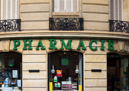 Paris, France - 19th March 2014: The outside of a Pharmacie in Paris showing the sign and window display