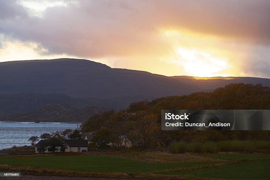 New Day Dawns The last of the days sunshine, sunset over Inveralligin on Loch Torridon, Scottish Highlands UK. Croft Stock Photo