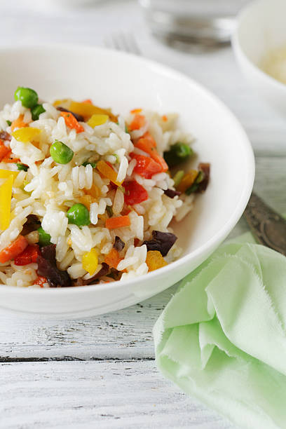 istock Rice with vegetables in a bowl 481116024