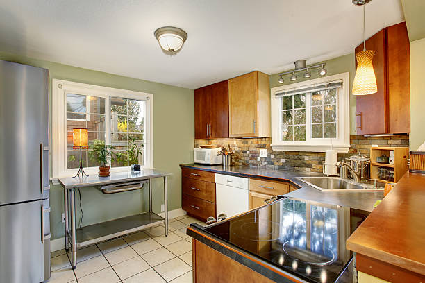 istock classic kitchen with green walls, and white tile floor. 481119656