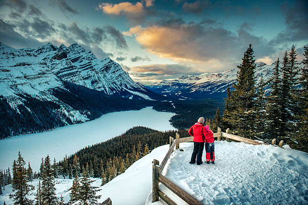 Mother and Daughter enjoying Banff National Park in Winter Mother and Daughter enjoying the winter views of Peyto Lake in Banff National park. Canada. alberta photos stock pictures, royalty-free photos & images