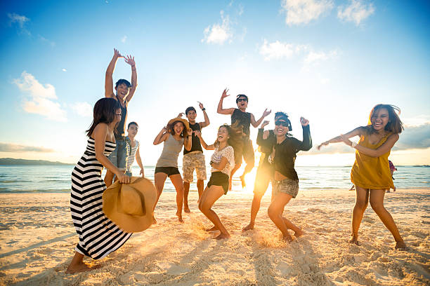 Happy people on beach Happy young people on beach beach party stock pictures, royalty-free photos & images