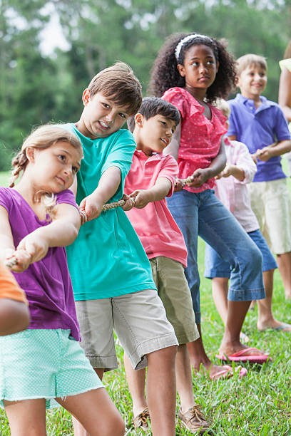istock Children playing tug of war 481124775