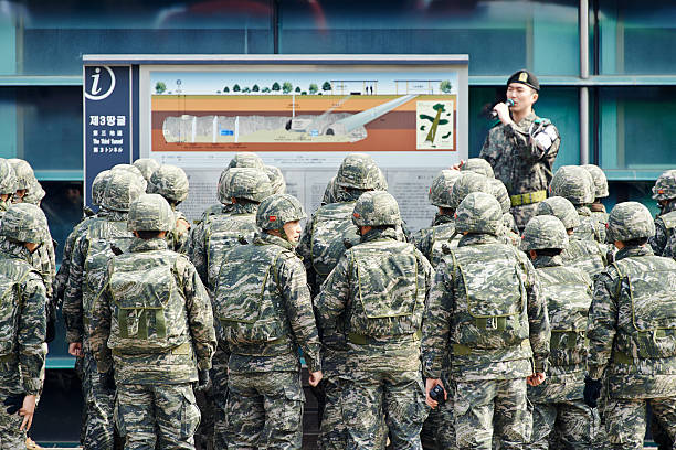 Paju, South Korea - March 15, 2014: a group of soldiers of Republic of Korea Marine Corps, listen the story of the 3rd Tunnel of Aggression from a militray leader. Site of the 3rd Tunnel of Aggression site.